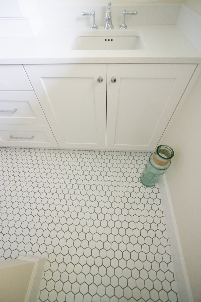 This is an example of a traditional bathroom in Orlando with white tile and ceramic tile.