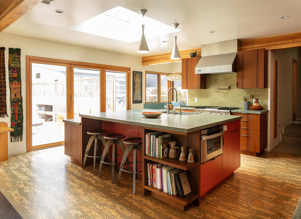 This is an example of a large midcentury l-shaped eat-in kitchen in Los Angeles with a double-bowl sink, flat-panel cabinets, dark wood cabinets, quartzite benchtops, green splashback, subway tile splashback, stainless steel appliances, cork floors, with island, beige floor, grey benchtop and exposed beam.