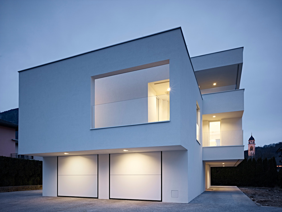 Inspiration for a contemporary three-storey white exterior in Other.