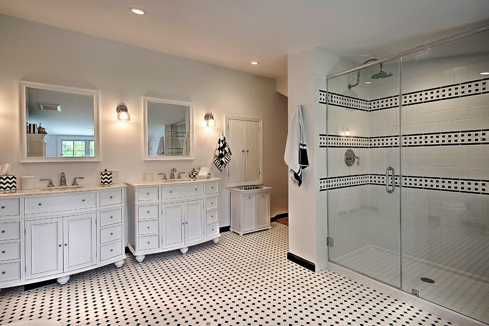 Design ideas for a large traditional master bathroom in New York with recessed-panel cabinets, white cabinets, an alcove shower, black and white tile, mosaic tile, white walls and an undermount sink.