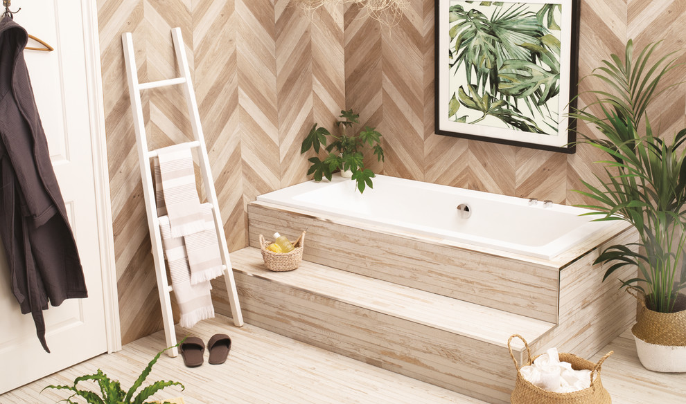 Inspiration for a mid-sized contemporary kids bathroom in Other with a drop-in tub, beige walls, bamboo floors and beige floor.
