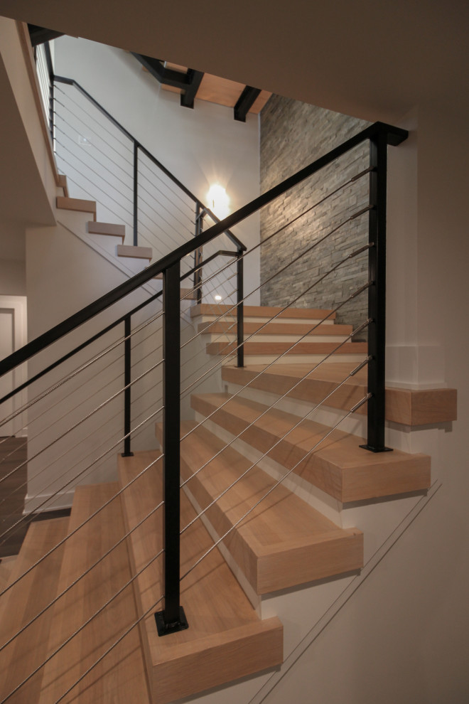 Staircase - large eclectic wooden floating metal railing and brick wall staircase idea in DC Metro