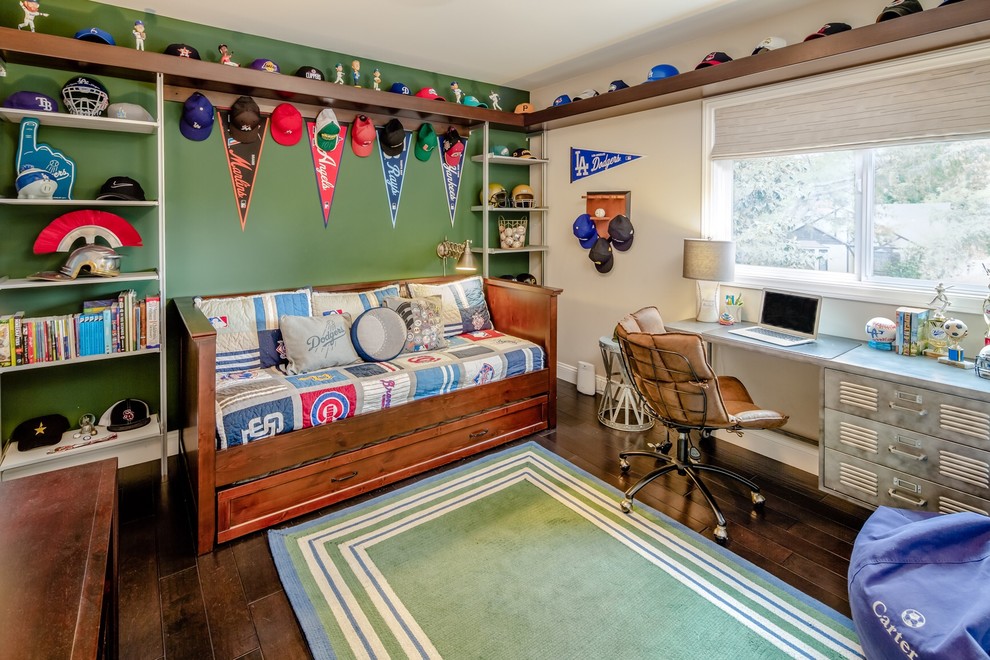 Transitional kids' bedroom in Los Angeles with green walls, dark hardwood floors and brown floor for boys.