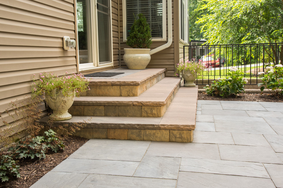 Photo of a mid-sized backyard patio in DC Metro with concrete pavers.