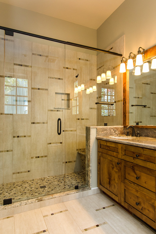 Mid-sized contemporary master bathroom in San Francisco with an undermount sink, shaker cabinets, medium wood cabinets, granite benchtops, an alcove shower, beige tile, porcelain tile, beige walls and porcelain floors.