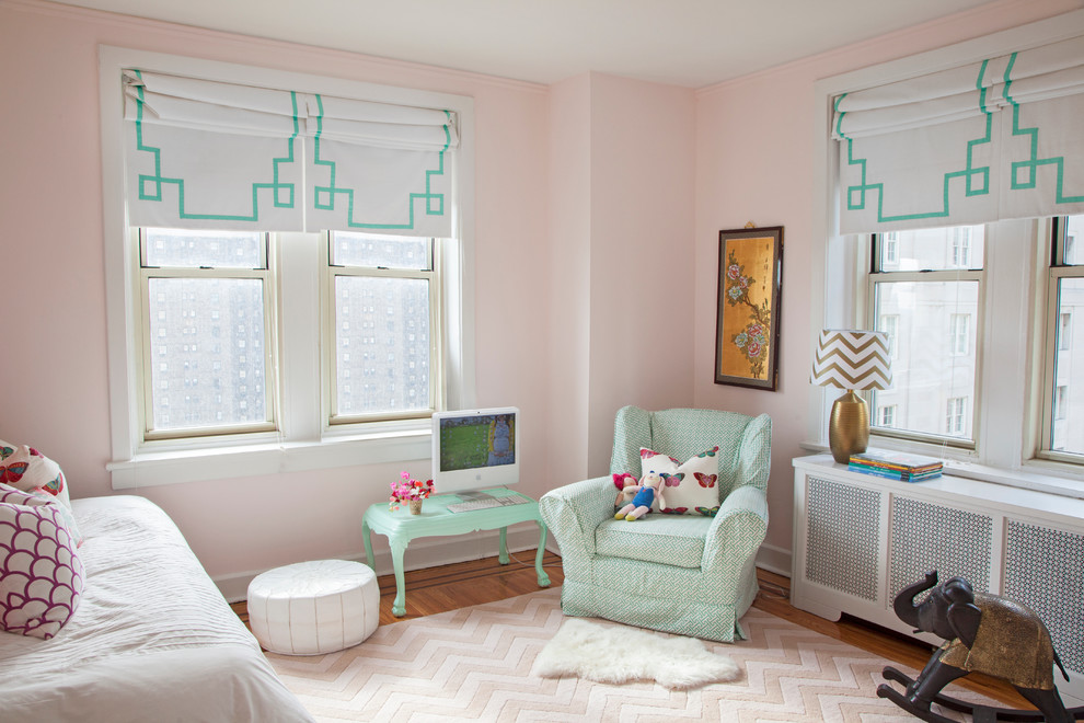 This is an example of an eclectic kids' room for girls in Philadelphia with pink walls.