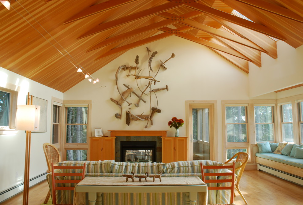 Inspiration for a mid-sized contemporary open concept light wood floor living room remodel in Portland Maine with white walls, a two-sided fireplace and a tile fireplace