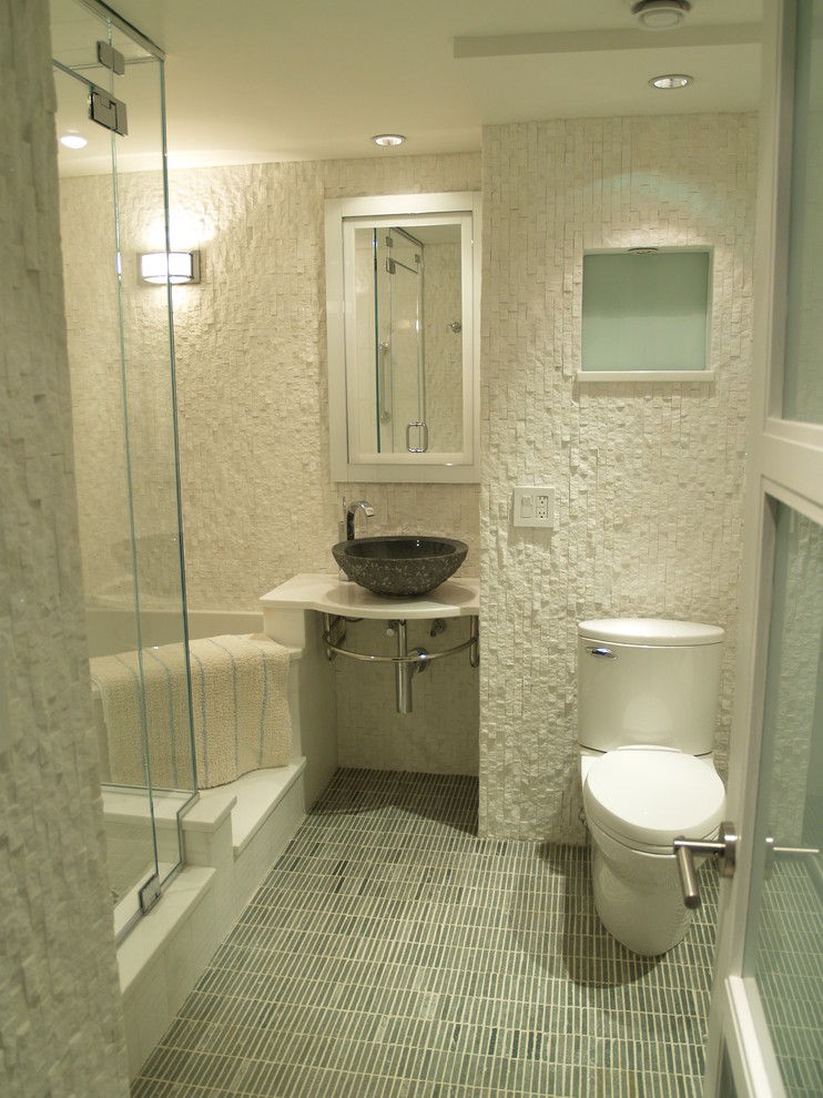 Design ideas for a mid-sized transitional 3/4 bathroom in New York with a vessel sink, a corner tub, a corner shower, a one-piece toilet, white walls, mosaic tile floors and solid surface benchtops.