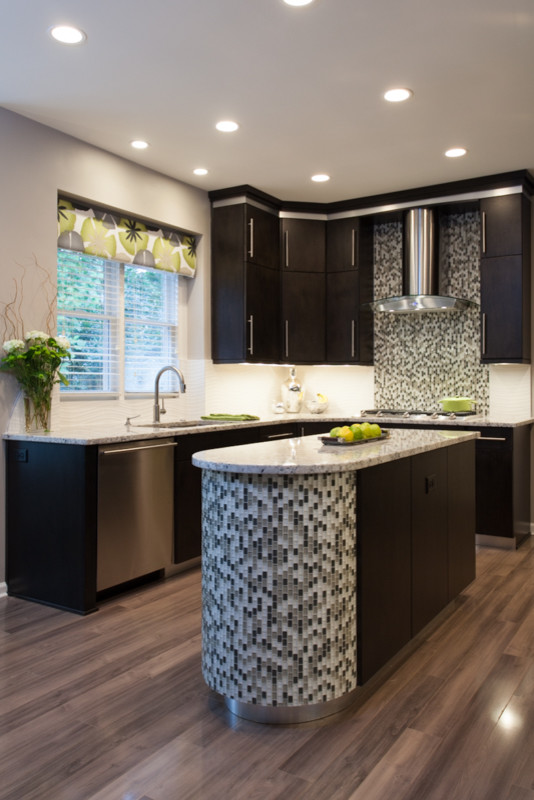 Inspiration for a contemporary l-shaped eat-in kitchen in Atlanta with an undermount sink, flat-panel cabinets, dark wood cabinets, granite benchtops, yellow splashback, porcelain splashback and stainless steel appliances.