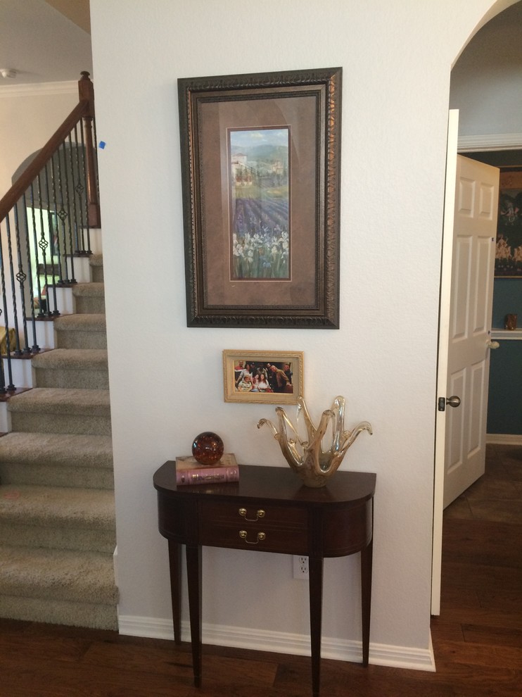 Example of a mid-sized transitional dark wood floor hallway design in Austin with gray walls