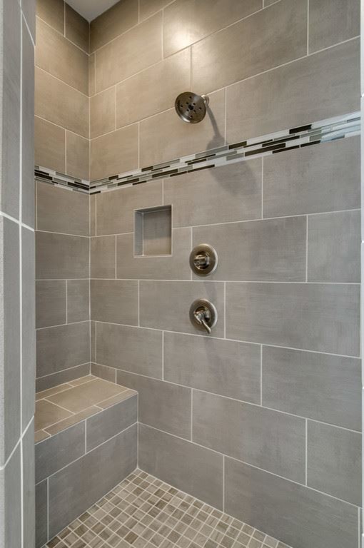 Inspiration for a mid-sized transitional 3/4 gray tile and porcelain tile porcelain tile and gray floor corner shower remodel with recessed-panel cabinets, black cabinets, beige walls, an undermount sink, granite countertops and a hinged shower door