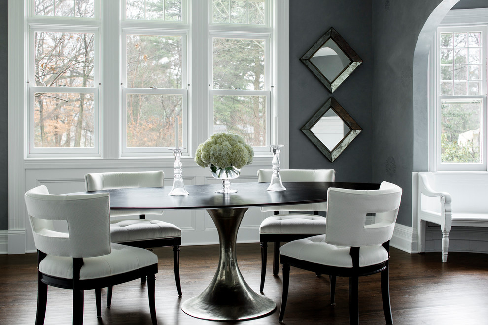 Traditional dining room in Boston with grey walls and dark hardwood floors.