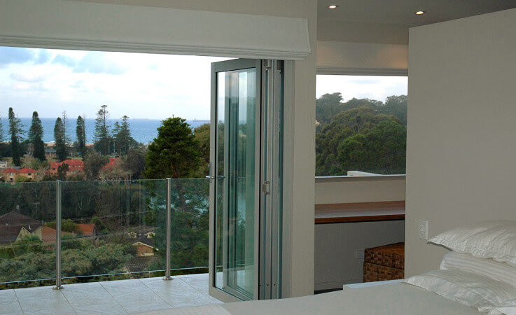 This is an example of a contemporary bedroom in Wollongong.