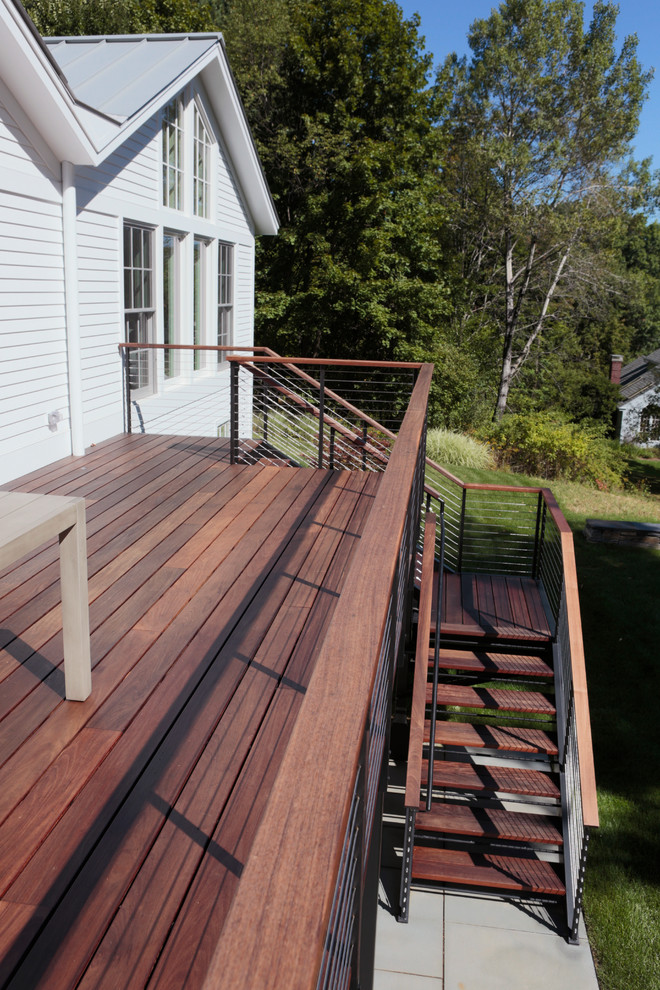 Inspiration for a mid-sized modern backyard deck remodel in Boston with no cover