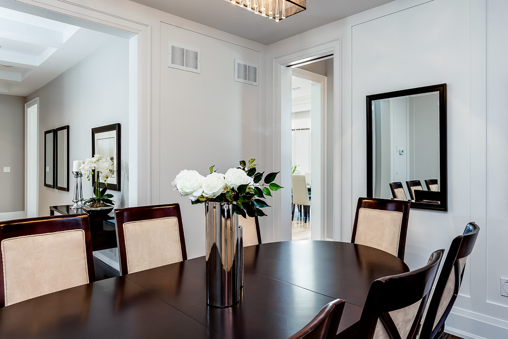 This is an example of a transitional dining room in Toronto.