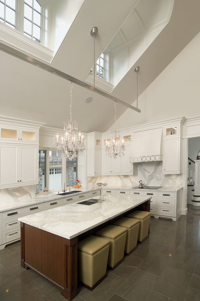 This is an example of a traditional kitchen in Toronto with recessed-panel cabinets, white cabinets, white splashback and stone slab splashback.