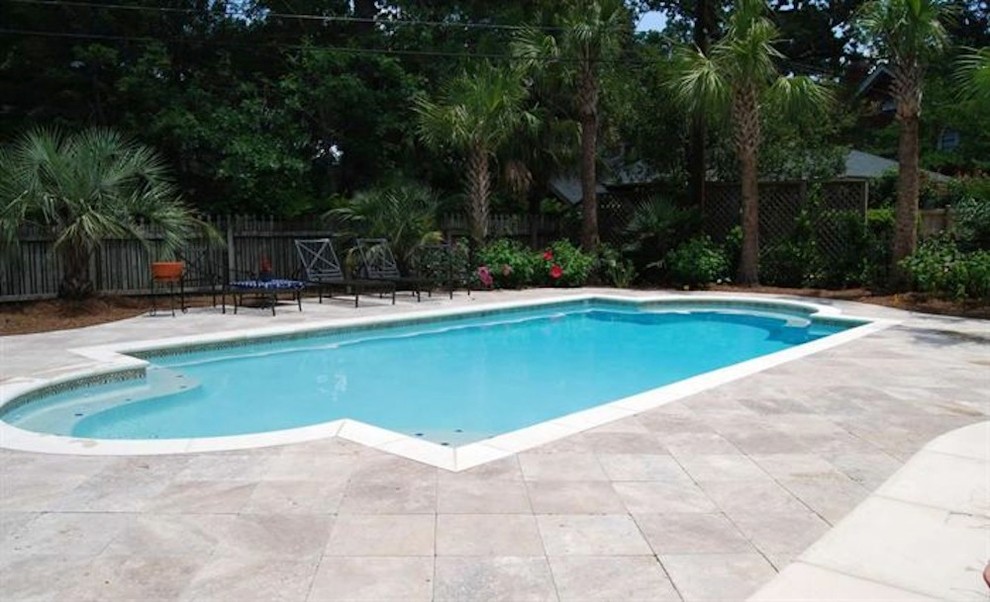 Inspiration for a mid-sized backyard stone and rectangular natural pool fountain remodel