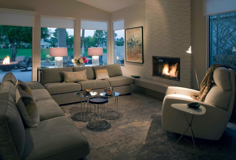 Inspiration for a contemporary carpeted living room remodel in Los Angeles with white walls, a standard fireplace and a tile fireplace