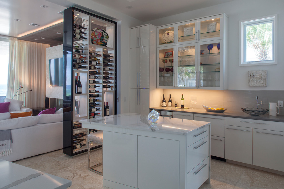 Inspiration for a mid-sized contemporary single-wall wet bar in Other with flat-panel cabinets, white cabinets, quartz benchtops, white splashback, ceramic splashback, travertine floors and beige floor.