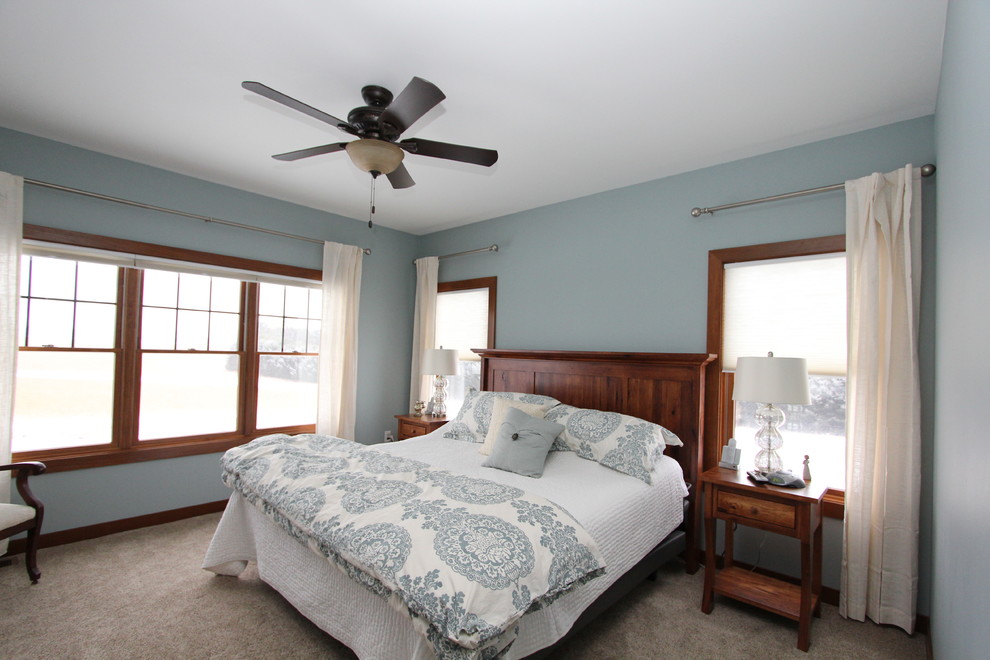 Photo of a small transitional guest bedroom in Milwaukee with green walls, carpet and no fireplace.
