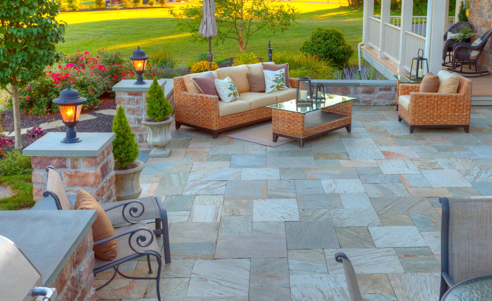 Design ideas for a large transitional backyard patio in Other with concrete pavers.