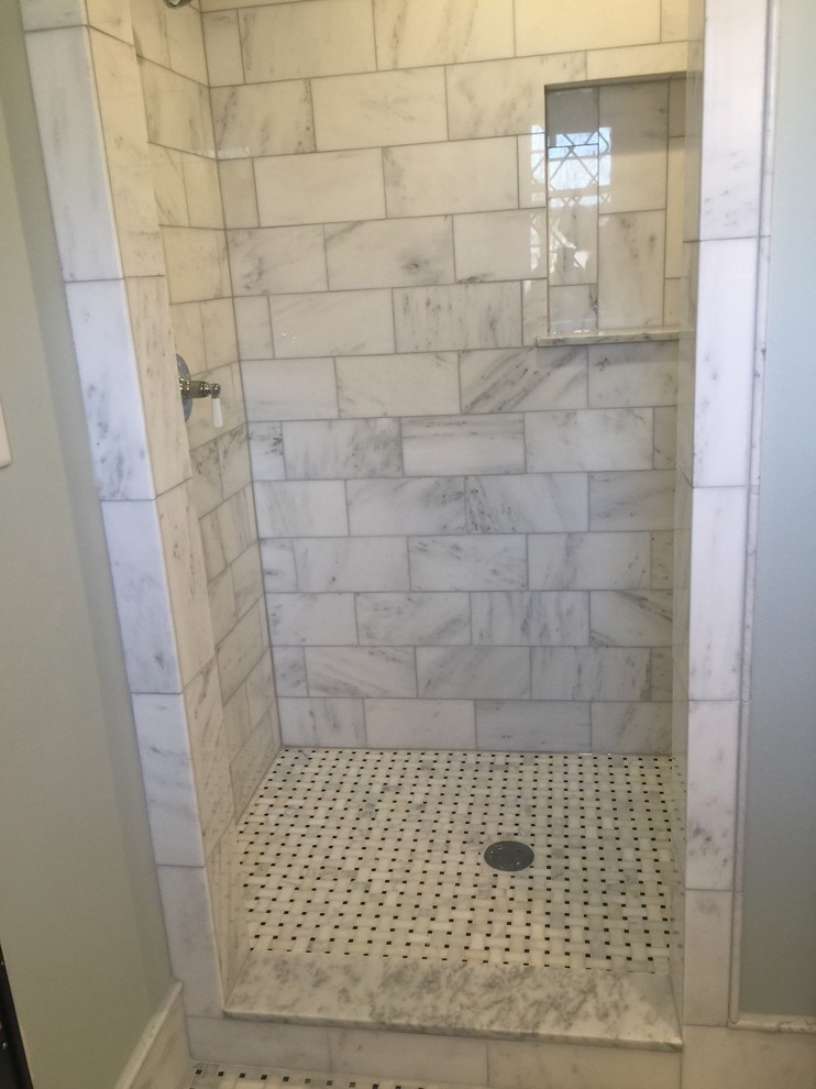 This is an example of a mid-sized contemporary 3/4 bathroom in Milwaukee with black and white tile, subway tile, shaker cabinets, white cabinets, an alcove shower, a two-piece toilet, grey walls, mosaic tile floors and a pedestal sink.