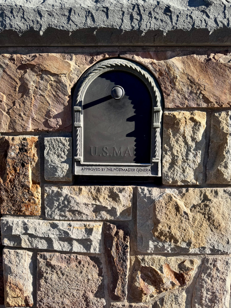 A decade of stonework, one company. This mailbox surround was built 10 years before Expedition existed — the same hands, the same standard.