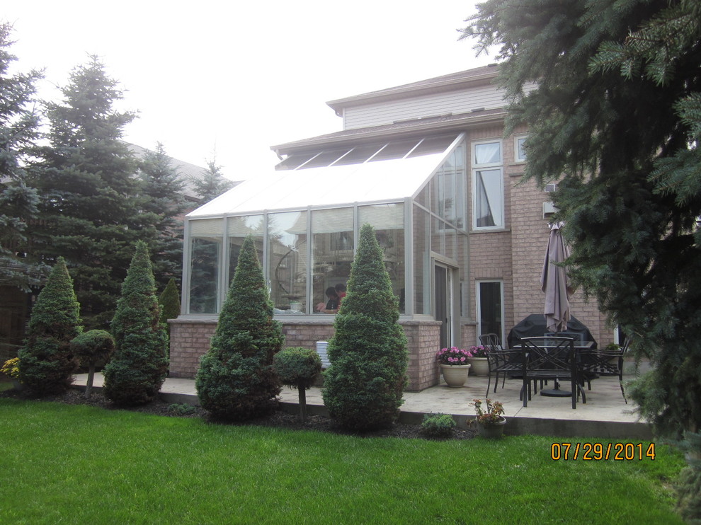 Photo of a traditional sunroom in Toronto.