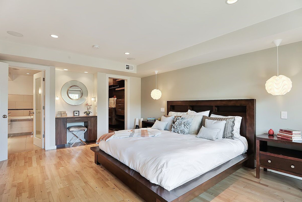 Inspiration for a contemporary master bedroom in San Francisco with beige walls, light hardwood floors and no fireplace.