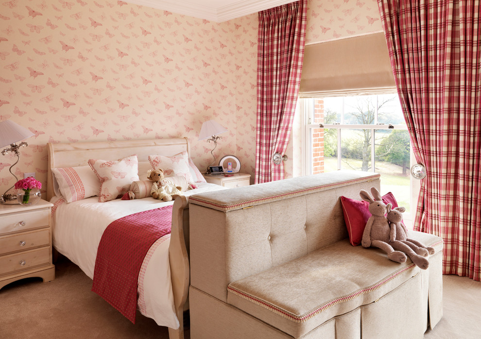 Design ideas for a mid-sized traditional kids' bedroom for kids 4-10 years old and girls in London with pink walls and carpet.