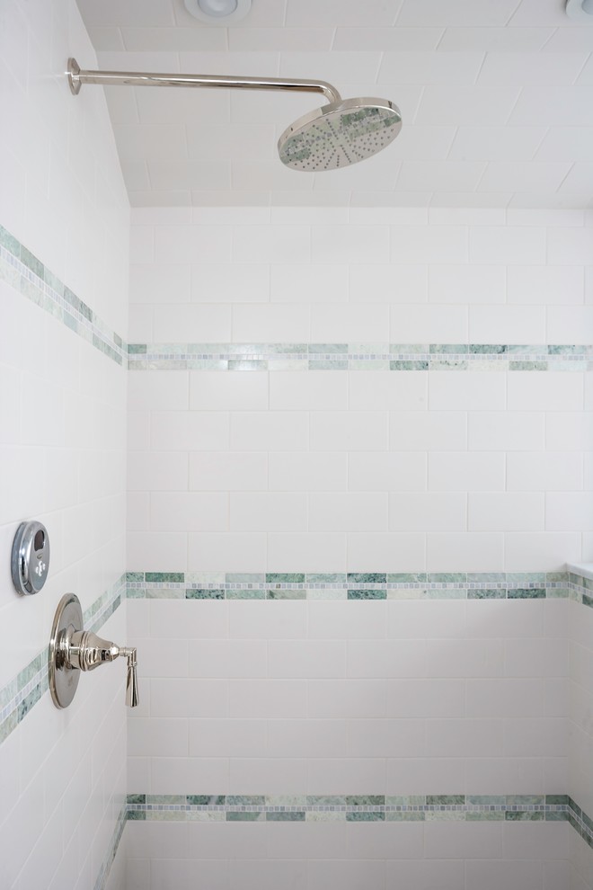 Photo of a large traditional master bathroom in Bridgeport with recessed-panel cabinets, grey cabinets, a drop-in tub, an alcove shower, gray tile, white tile, subway tile, white walls, ceramic floors, an undermount sink and marble benchtops.