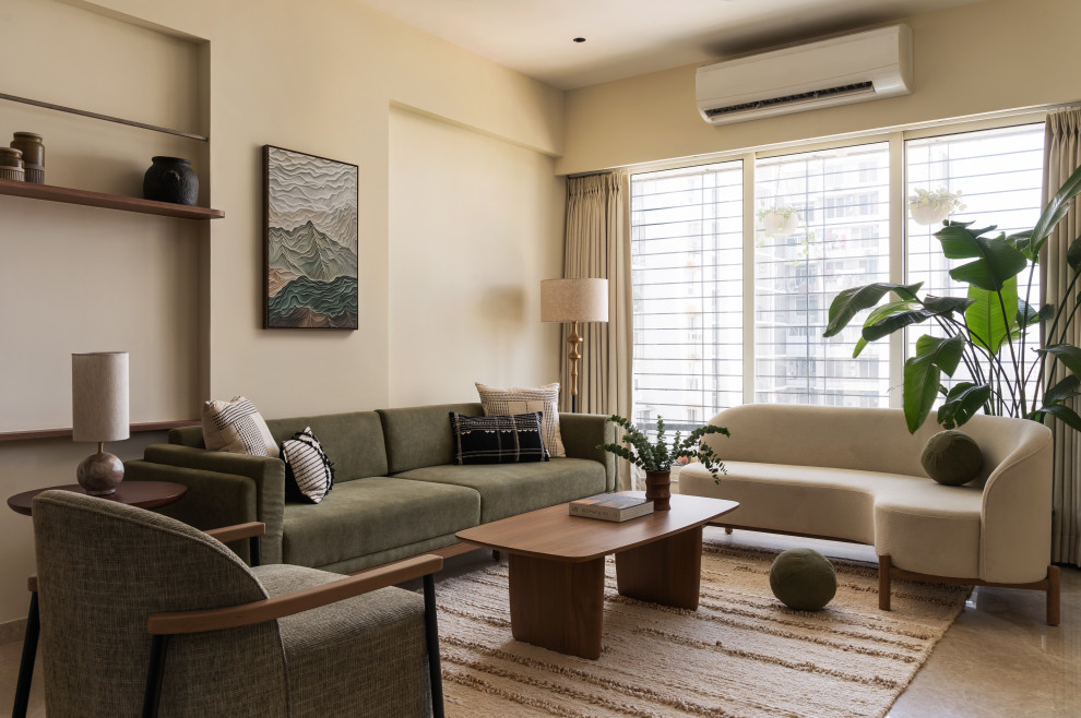 Design ideas for a contemporary living room in Mumbai With Beige Walls.
