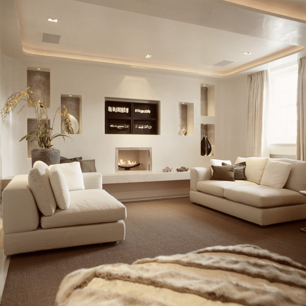 Medium sized contemporary open plan living room feature wall in London with a home bar, beige walls, bamboo flooring, a ribbon fireplace, a metal fireplace surround, a built-in media unit, beige floors, a coffered ceiling and a feature wall.