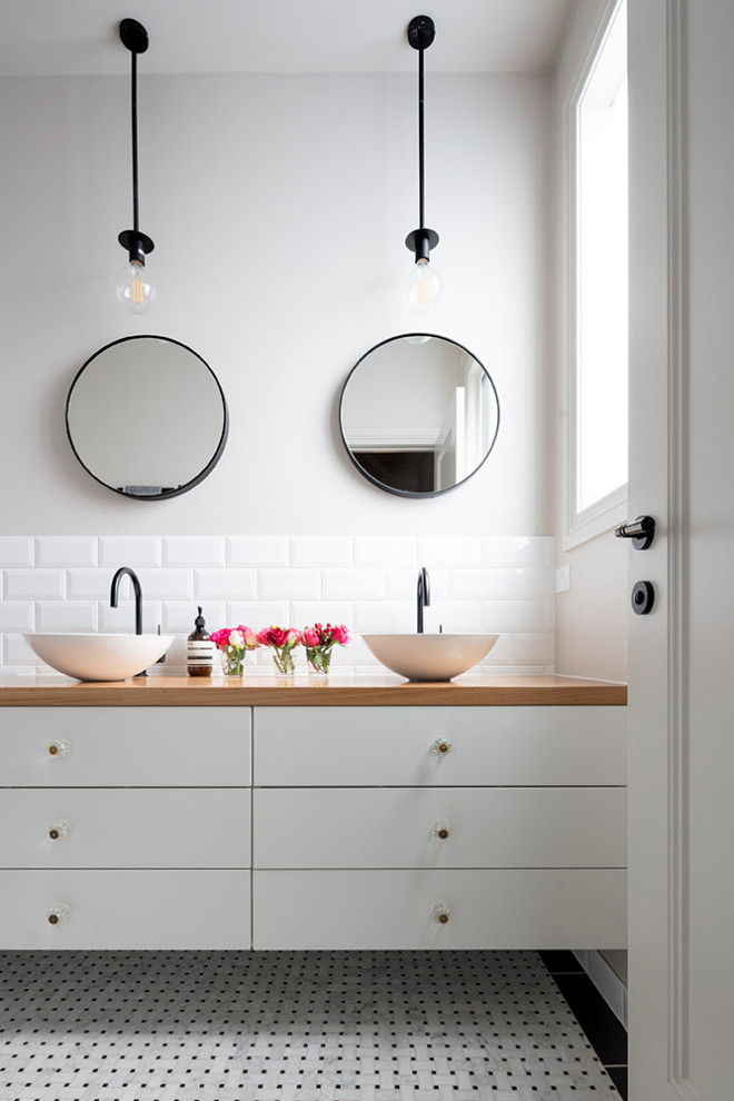 Inspiration for a contemporary bathroom in Melbourne with flat-panel cabinets, white cabinets, white tile, subway tile, grey walls, mosaic tile floors, a vessel sink, wood benchtops, multi-coloured floor and brown benchtops.