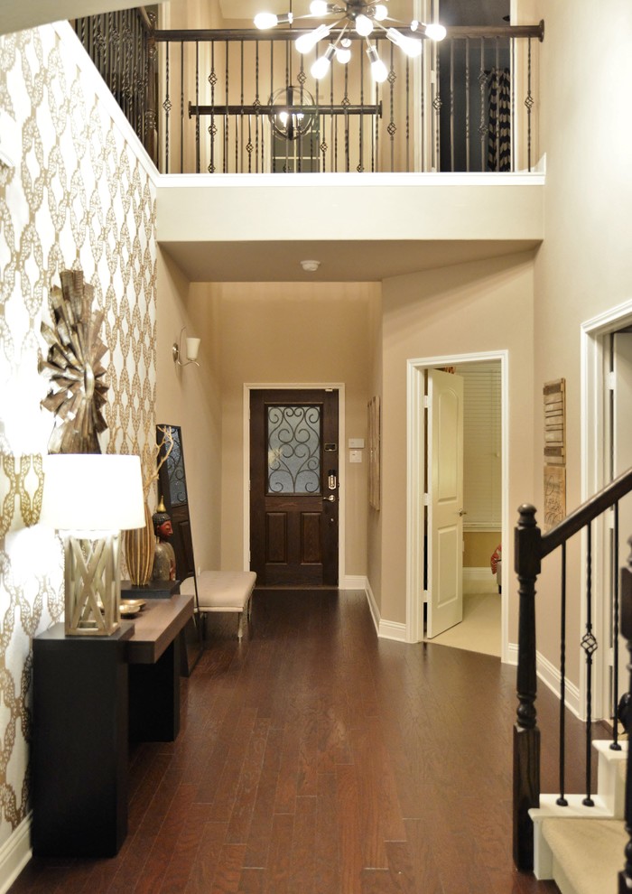 Foyer - mid-sized transitional dark wood floor foyer idea in Austin with beige walls and a dark wood front door