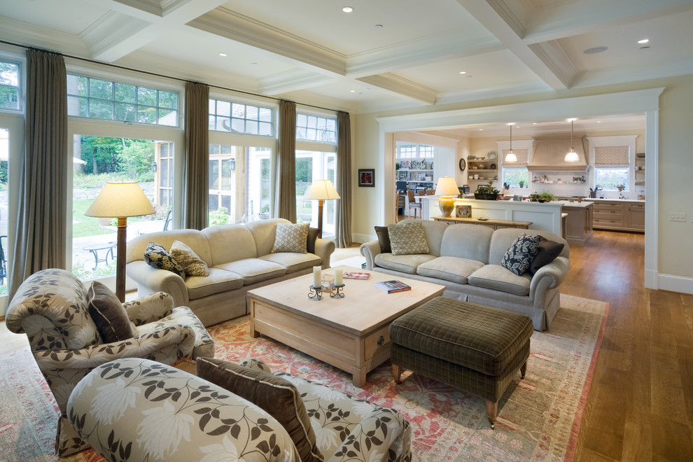 Photo of a traditional open concept family room in DC Metro with beige walls and medium hardwood floors.