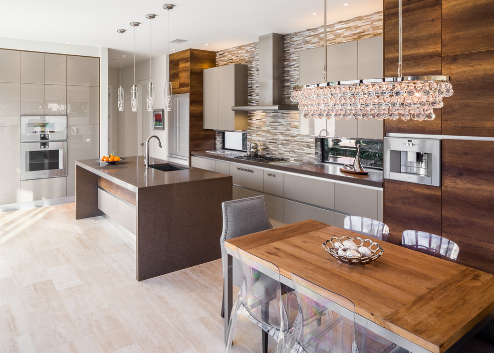 Design ideas for a mid-sized contemporary eat-in kitchen in Austin with an undermount sink, flat-panel cabinets, grey cabinets, quartz benchtops, matchstick tile splashback, stainless steel appliances, travertine floors, with island, multi-coloured splashback and beige floor.