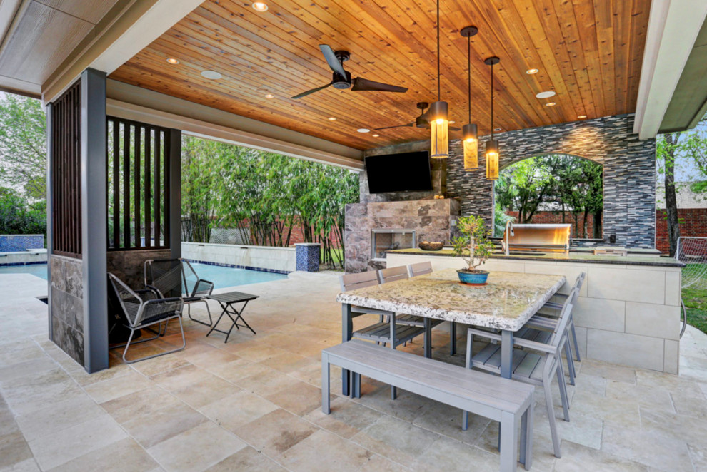 Design ideas for a mid-sized traditional backyard patio in Houston with an outdoor kitchen, tile and a gazebo/cabana.
