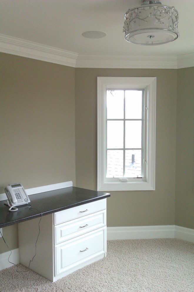 Example of a large eclectic built-in desk carpeted home design design in Toronto with beige walls