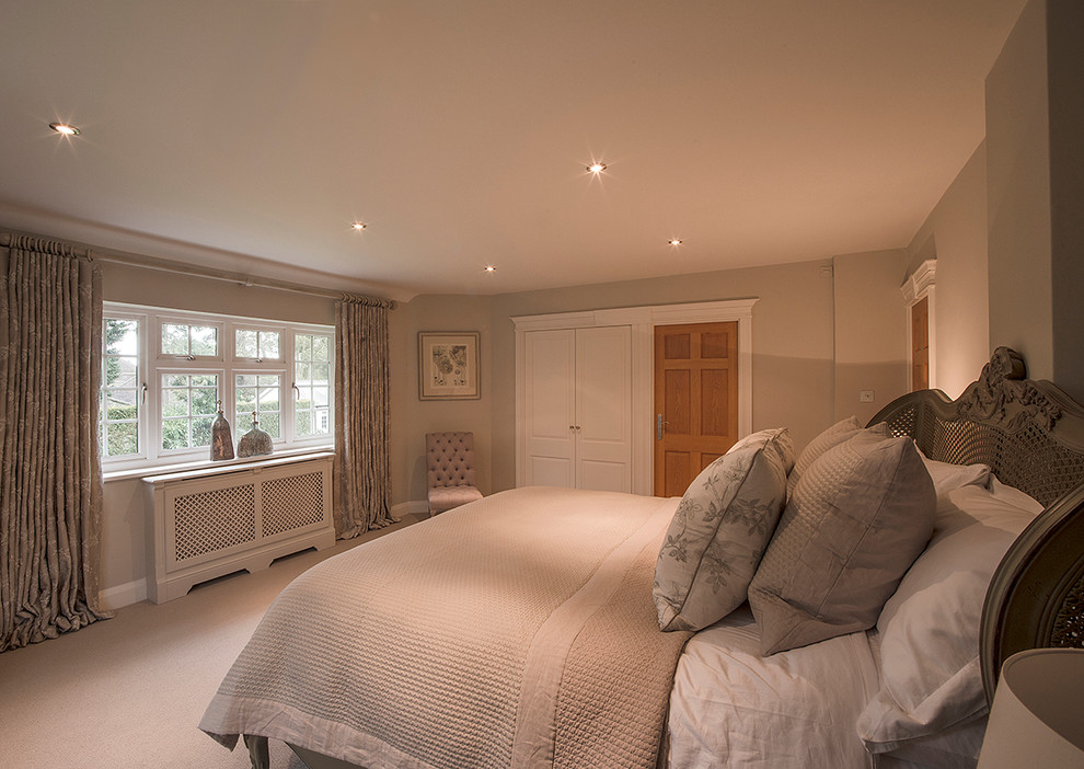 This is an example of a contemporary bedroom in Hampshire.