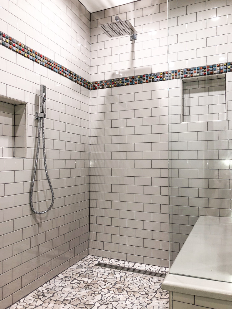This is an example of a mid-sized industrial 3/4 bathroom in Denver with flat-panel cabinets, dark wood cabinets, a curbless shower, a one-piece toilet, white tile, ceramic tile, yellow walls, concrete floors, an integrated sink, solid surface benchtops, grey floor, an open shower and beige benchtops.