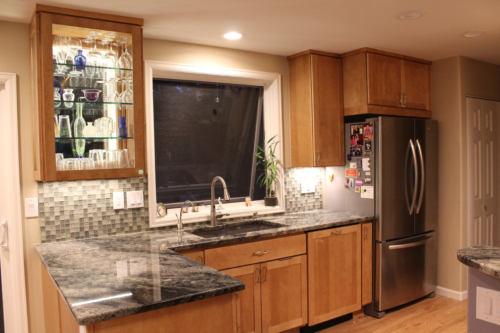 Small transitional light wood floor kitchen photo in Denver with an undermount sink, recessed-panel cabinets, light wood cabinets, granite countertops, green backsplash, glass tile backsplash, stainless steel appliances and no island