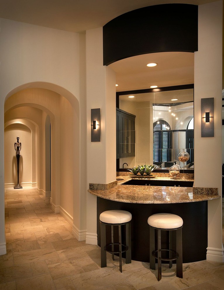 Large transitional hallway in Miami with beige walls, beige floor and limestone floors.