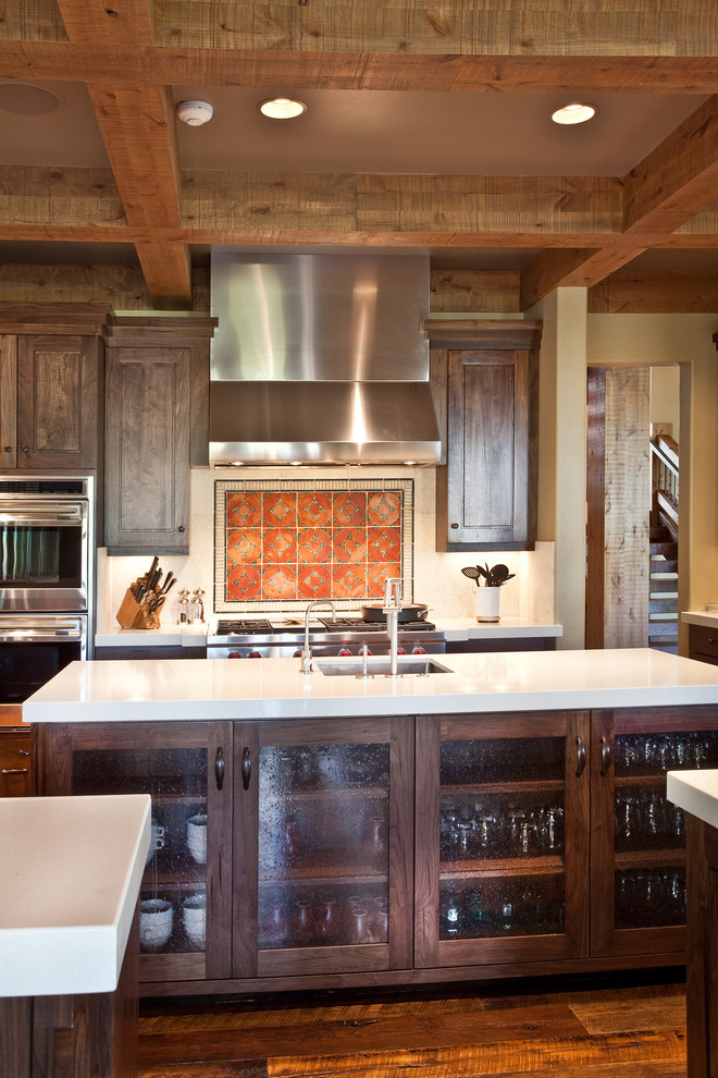 Design ideas for a country kitchen in Salt Lake City with glass-front cabinets and stainless steel appliances.