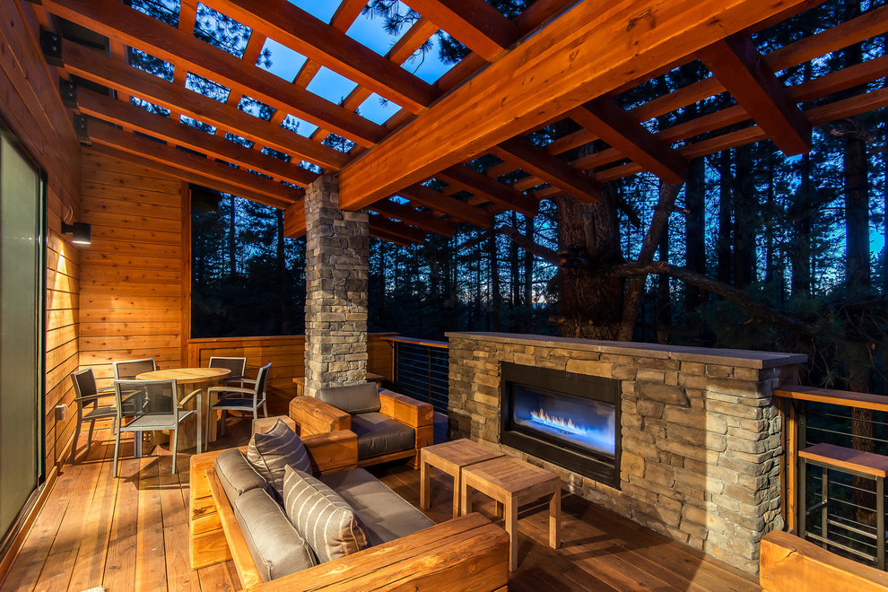 This is an example of a country deck in Sacramento with a fire feature and a pergola.