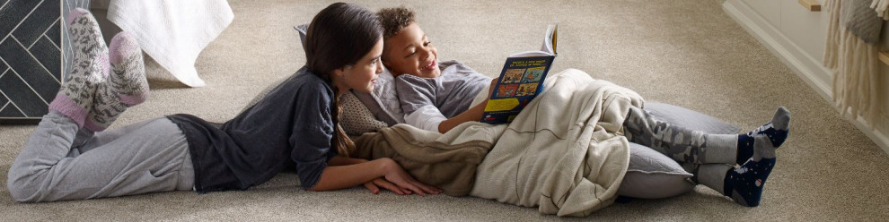 kids reading on rug floor