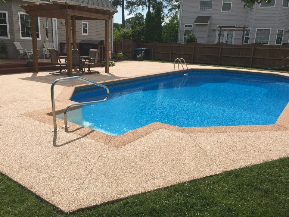 Inspiration for a mid-sized transitional backyard concrete pool remodel