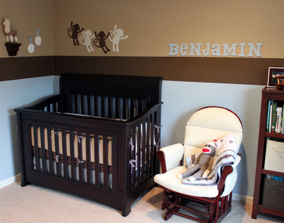 This is an example of a mid-sized traditional kids' room for boys in Chicago with blue walls and carpet.