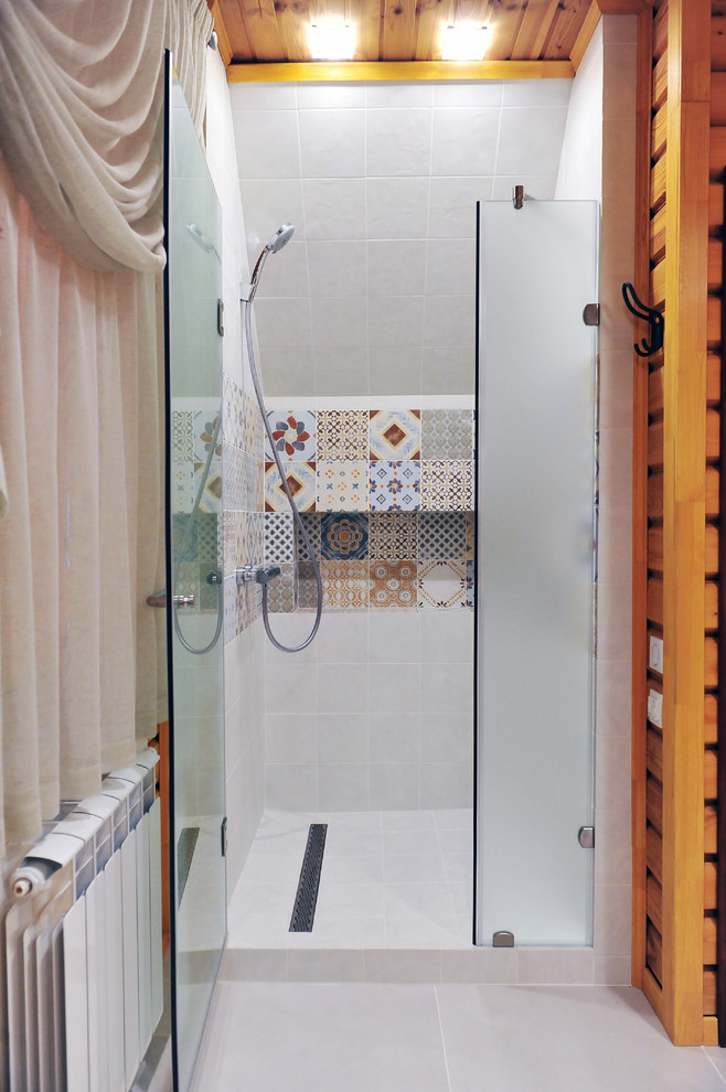 Photo of a mid-sized country bathroom in Other with multi-coloured tile, ceramic tile, beige walls and porcelain floors.