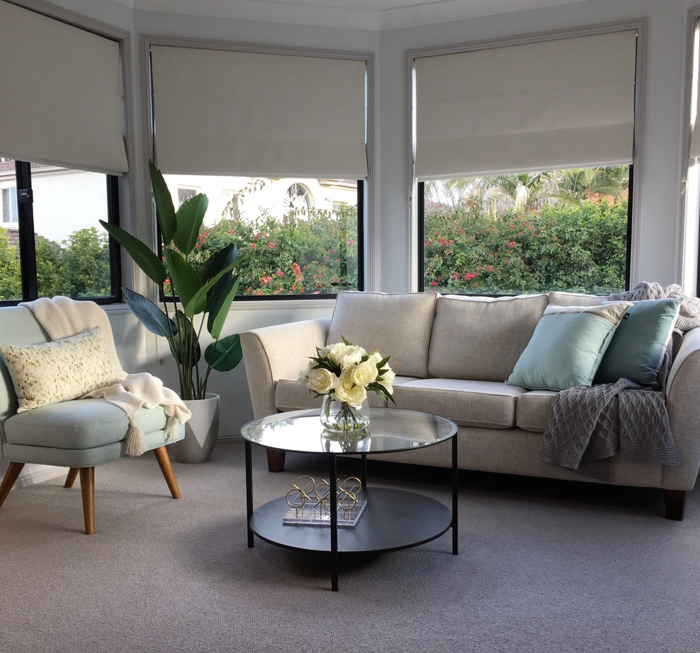 This is an example of a large contemporary master bedroom in Sydney with white walls, carpet and grey floor.